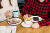 couple drinking coffee, eating baked goods