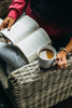 Person holding mug and reading book